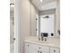 Clean bathroom with a white marble vanity, large mirror, and access to the shower at 1151 Goodwin Ne Rd, Brookhaven, GA 30324