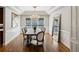 Formal dining room with coffered ceiling, hardwood floors, and chandelier at 1151 Goodwin Ne Rd, Brookhaven, GA 30324
