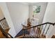 Bright foyer with hardwood floors, staircase with iron railings and a high ceiling at 1151 Goodwin Ne Rd, Brookhaven, GA 30324