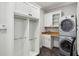 Convenient laundry room with stainless steel washer and dryer and extra storage at 1151 Goodwin Ne Rd, Brookhaven, GA 30324