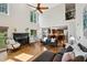 Bright and spacious living room with high ceilings, fireplace, and open concept layout to kitchen at 1151 Goodwin Ne Rd, Brookhaven, GA 30324