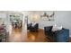Open concept living area with hardwood floors, elegant furniture, and dining room in background at 1151 Goodwin Ne Rd, Brookhaven, GA 30324
