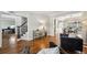 Open concept living area featuring hardwood floors, staircase, and view into office and dining room at 1151 Goodwin Ne Rd, Brookhaven, GA 30324