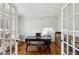 Well-lit home office featuring hardwood floors, French doors, and neutral walls at 1151 Goodwin Ne Rd, Brookhaven, GA 30324