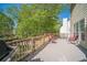 Outdoor deck with natural wooded views, grill, and seating perfect for entertaining at 1356 Belfaire Trce, Dacula, GA 30019