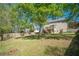 Large backyard with a deck, patio, green grass and a wood fence offers ample outdoor space at 1356 Belfaire Trce, Dacula, GA 30019