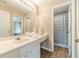 Bathroom with wood floors, neutral decor, and combined shower and tub at 1356 Belfaire Trce, Dacula, GA 30019