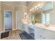 Bright bathroom with double sink vanity, ample counter space, and neutral color palette at 1356 Belfaire Trce, Dacula, GA 30019