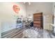 Spacious bedroom with wood floors, a ceiling fan, and plenty of room for a desk at 1356 Belfaire Trce, Dacula, GA 30019