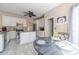 Open-concept kitchen includes granite countertops, stainless appliances, a central island, and an eat-in dining area at 1356 Belfaire Trce, Dacula, GA 30019