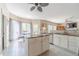 Modern kitchen with a large island, granite countertops, and stainless steel appliances at 1356 Belfaire Trce, Dacula, GA 30019