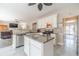 Bright kitchen with a large island, granite countertops, and stainless steel appliances at 1356 Belfaire Trce, Dacula, GA 30019
