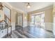 Spacious living room featuring wood floors, a bay window, and a view of the front door at 1356 Belfaire Trce, Dacula, GA 30019