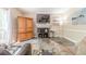 Cozy living room features neutral paint, fireplace, mounted TV, and comfortable seating at 1356 Belfaire Trce, Dacula, GA 30019