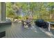 Spacious deck with an outdoor dining set and grill, great for backyard barbecues and entertaining at 1420 Lockridge Dr, Cumming, GA 30041
