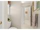 Cozy bathroom with decorative accents and a view into an adjoining space at 1420 Lockridge Dr, Cumming, GA 30041