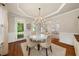 Open dining room with wood floors, chandelier, and natural light at 1420 Lockridge Dr, Cumming, GA 30041