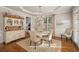 Formal dining room with hardwood floors, chandelier, and elegant furnishings at 1420 Lockridge Dr, Cumming, GA 30041
