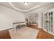 Bright dining room features hardwood floors, white trim, and cabinet at 1420 Lockridge Dr, Cumming, GA 30041