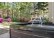 Relaxing hot tub with massaging jets overlooks the private, wooded backyard at 1420 Lockridge Dr, Cumming, GA 30041