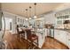 Spacious kitchen with stainless steel appliances, breakfast bar, and hardwood floors at 1420 Lockridge Dr, Cumming, GA 30041
