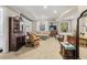 Finished basement with a seating area, desk, and ample natural light from the windows at 1420 Lockridge Dr, Cumming, GA 30041