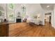 Bright living room with fireplace, large windows, and hardwood floors at 1420 Lockridge Dr, Cumming, GA 30041