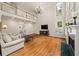Bright living room features fireplace and second-story balcony at 1420 Lockridge Dr, Cumming, GA 30041