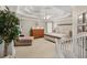 Spacious main bedroom with a trey ceiling, ceiling fan and seating area at 1420 Lockridge Dr, Cumming, GA 30041