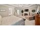 Spacious main bedroom with a trey ceiling, ceiling fan and a fireplace at 1420 Lockridge Dr, Cumming, GA 30041
