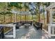 Beautiful deck with pergola and bench seating, perfect for entertaining guests outdoors at 1420 Lockridge Dr, Cumming, GA 30041