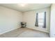 Cozy bedroom with neutral walls, carpet flooring, natural light, and study space at 2142 Theberton Trl, Locust Grove, GA 30248