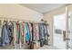 Walk-in closet with wire shelving providing ample storage space for all your wardrobe needs at 2142 Theberton Trl, Locust Grove, GA 30248