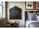 Charming bedroom with a chalkboard wall decoration and a black accent table at 4725 Montane St, Cumming, GA 30028