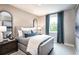 Cozy bedroom with plenty of natural light, a gray bed frame, and neutral decor at 4725 Montane St, Cumming, GA 30028