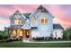 Charming two-story home featuring a blend of brick and siding, plus a welcoming front porch and a well-manicured lawn at 4725 Montane St, Cumming, GA 30028