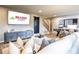 Inviting living room features a large TV, comfy seating, stylish decor, and entertainment options at 4725 Montane St, Cumming, GA 30028