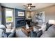 Inviting living room with a cozy fireplace and views from the large window at 4725 Montane St, Cumming, GA 30028