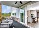 Relaxing outdoor patio with dining area and views, seamlessly connected to indoor dining and staircase at 4725 Montane St, Cumming, GA 30028