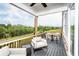 Relaxing outdoor patio with comfortable seating, a dining area, and views of the landscaped surroundings at 4725 Montane St, Cumming, GA 30028