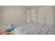 Cozy bedroom with neutral walls, plush carpet, closet, and an open doorway at 5177 Cabot Creek Dr, Buford, GA 30518