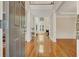 Elegant entryway with hardwood floors, high ceilings, and views into the living room at 5177 Cabot Creek Dr, Buford, GA 30518