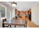 Well-appointed kitchen with wood cabinetry, stainless steel appliances, and a central island at 5177 Cabot Creek Dr, Buford, GA 30518