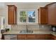 Gourmet kitchen featuring granite countertops, stainless steel appliances, and natural light at 5177 Cabot Creek Dr, Buford, GA 30518