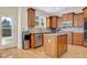 Updated kitchen features stainless appliances, granite counters, a center island, and backyard access at 5177 Cabot Creek Dr, Buford, GA 30518