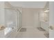 This roomy bathroom features a walk-in shower, soaking tub, and dual vanity sinks at 5177 Cabot Creek Dr, Buford, GA 30518
