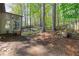 A spacious backyard features mature trees, lush landscaping, and a privacy fence at 660 Gran Heritage Way, Dacula, GA 30019