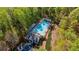 Aerial view of a pristine community pool surrounded by lush greenery and comfortable lounge seating at 660 Gran Heritage Way, Dacula, GA 30019