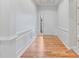 Bright entryway showcasing wood floors, white walls, and decorative wall trim at 660 Gran Heritage Way, Dacula, GA 30019