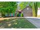 Charming brick home with a well-manicured lawn, mature landscaping, and a two-car garage at 660 Gran Heritage Way, Dacula, GA 30019